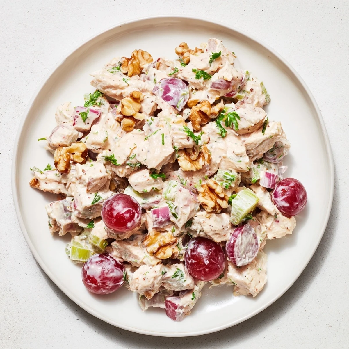 Creamy chicken salad, a delightful mix of diced chicken and crisp vegetables, ready to serve.
