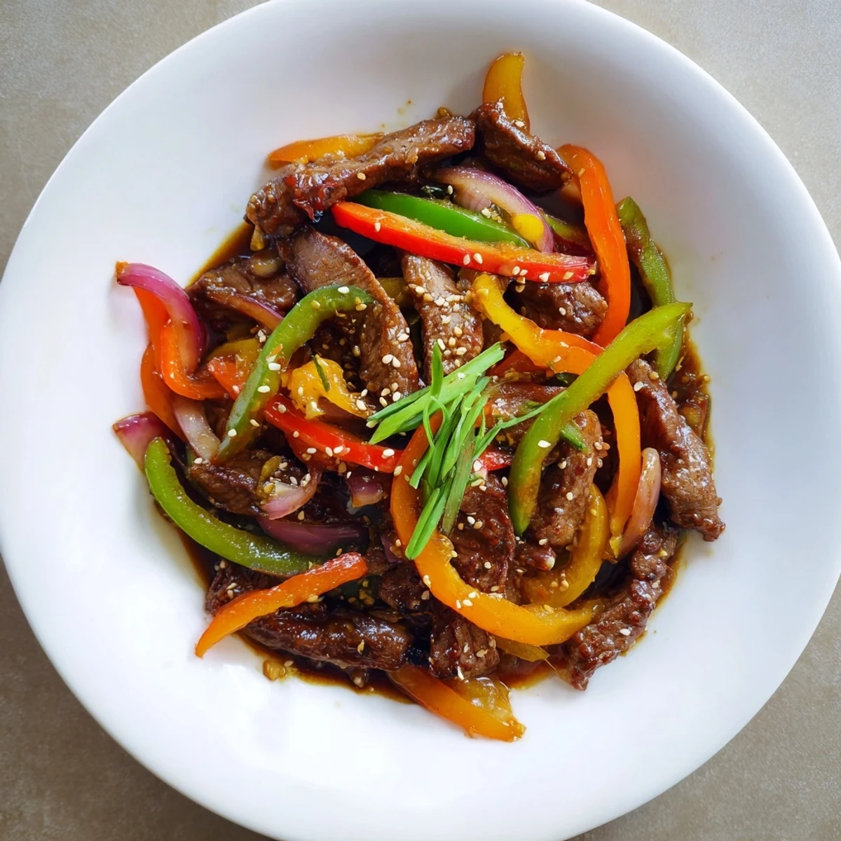 Crispy bell peppers and tender beef mingle in this savory Spicy Beef and Pepper Stir Fry dish.