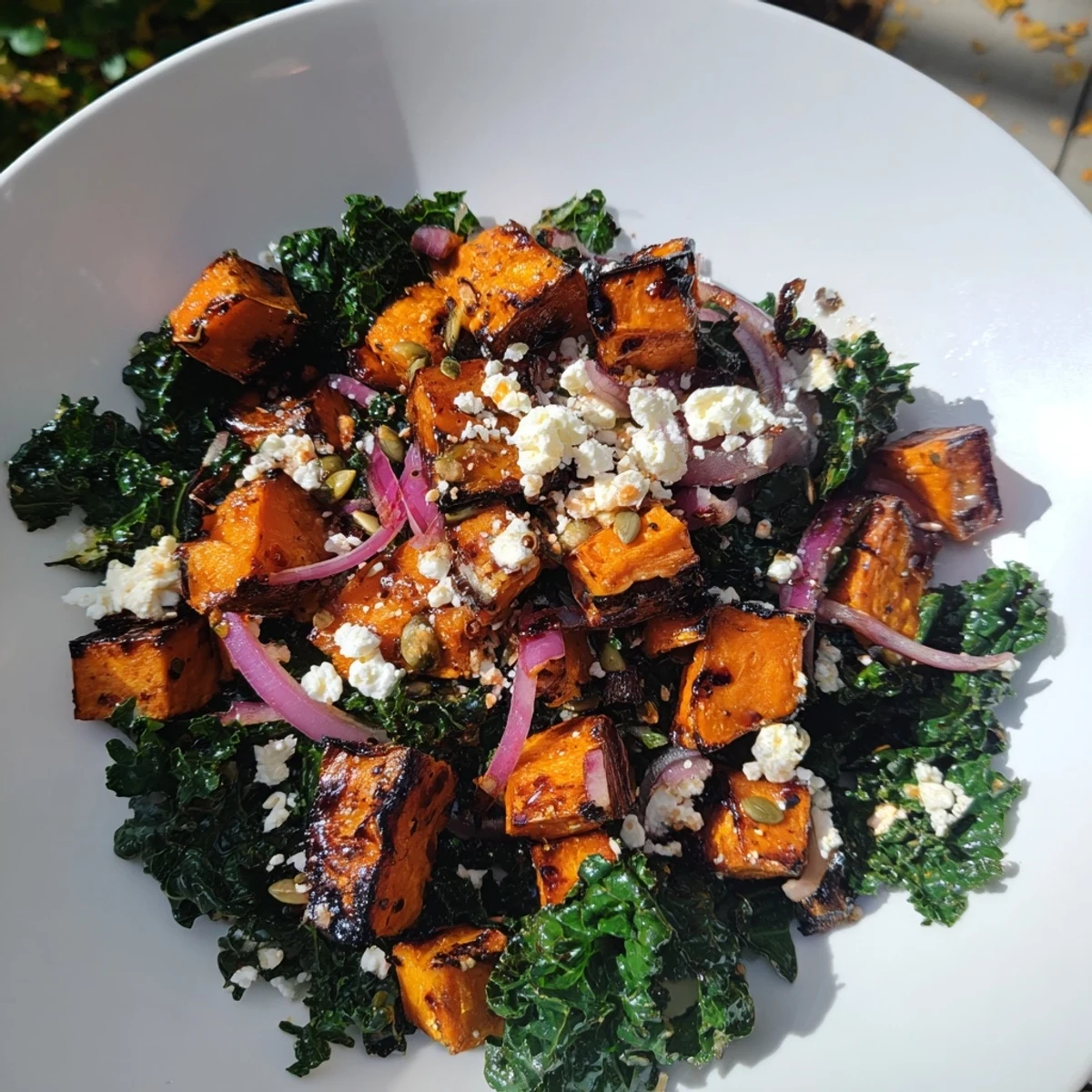 A colorful bowl of Roasted Sweet Potato and Kale Salad, perfect for a fresh, healthy meal.