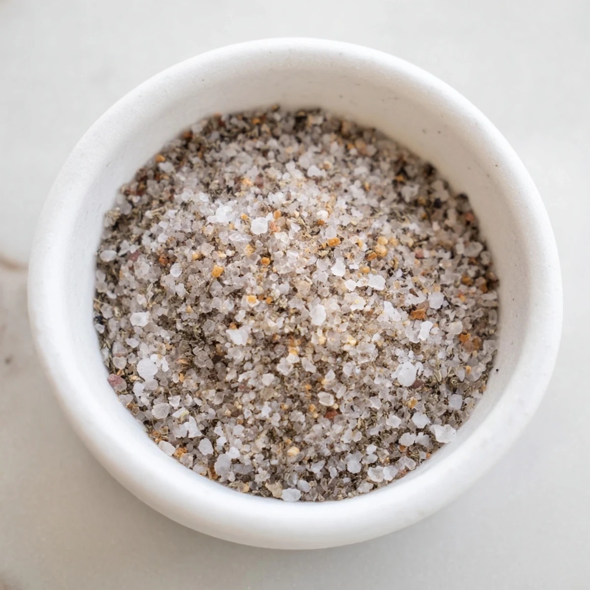 Close-up of a colorful bowl of freshly mixed Spiced Salt Mix, perfect for seasoning.