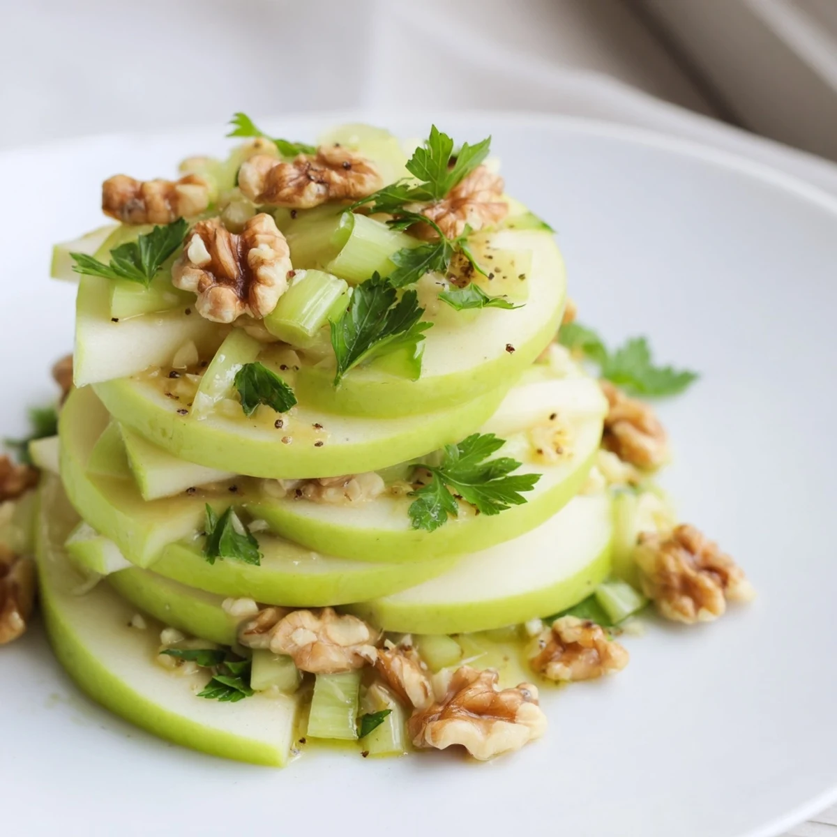Green Apple and Celery Salad with crisp, tart apples, crunchy celery, and fresh parsley in a zesty lemon dressing.