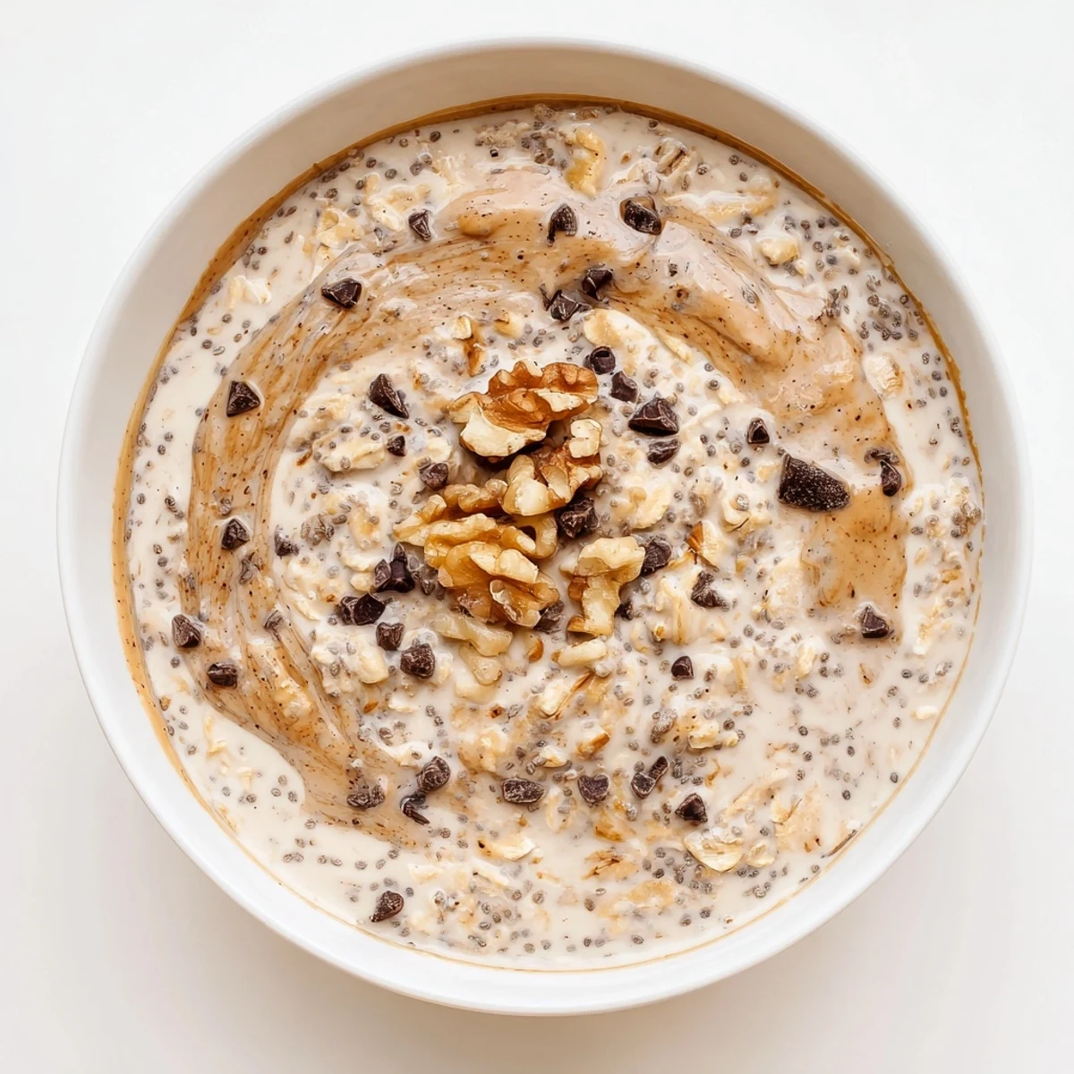 A beautiful serving of Cookie Dough Overnight Oats layered with oats, chia seeds, and maple syrup for an indulgent yet healthy start.