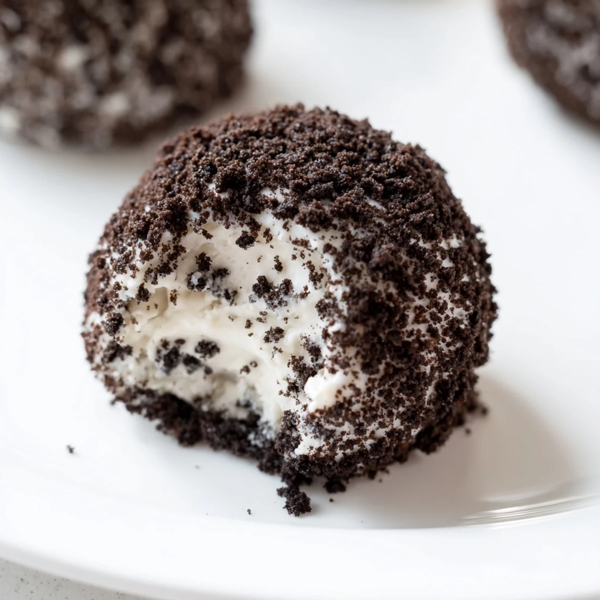 The image shows Cream Cheese Oreo Protein Balls on a plate, perfect for a quick post-workout snack.