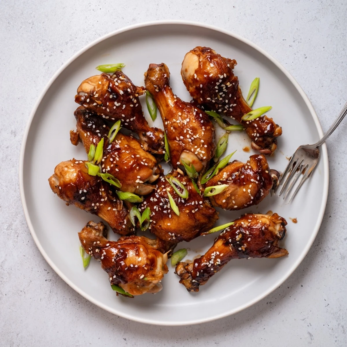 Slow cooker Asian glazed chicken drumsticks coated in a sticky savory-sweet glaze