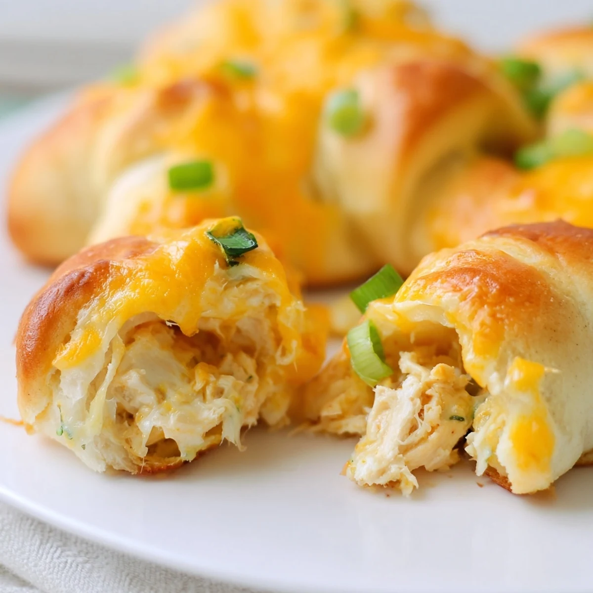 Comforting homemade cheesy chicken crescent bake served fresh from the oven with golden pastry and gooey cheese pull
