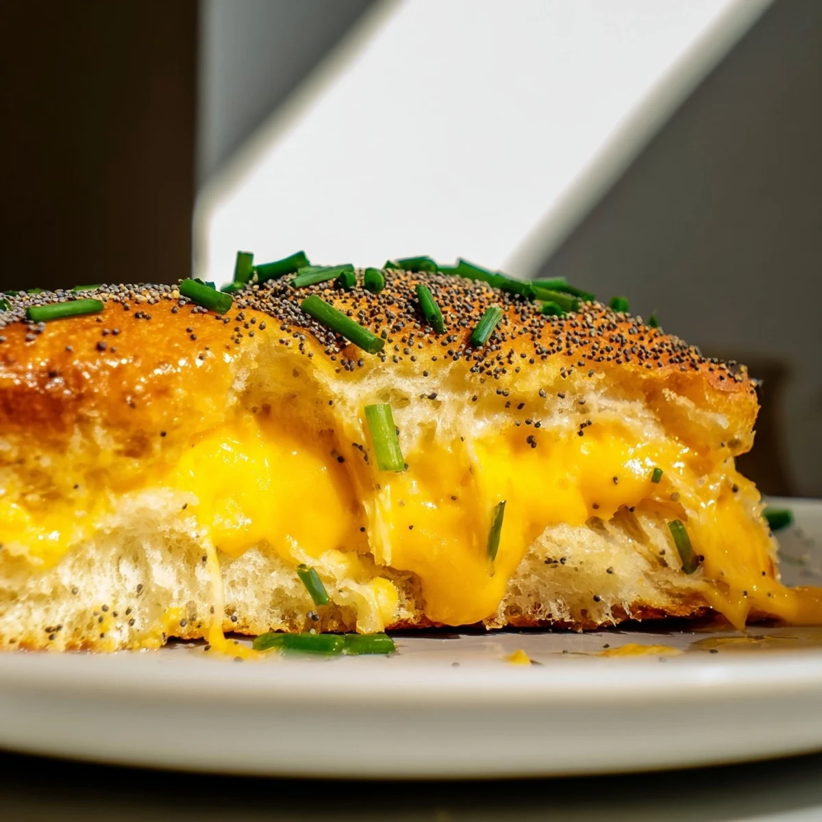 Buttery toasted sweet rolls stuffed with sharp cheddar and savory ham for easy appetizer bites