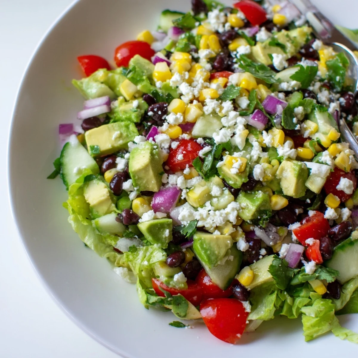 Crunchy Mexican chopped salad loaded with colorful vegetables and creamy avocado