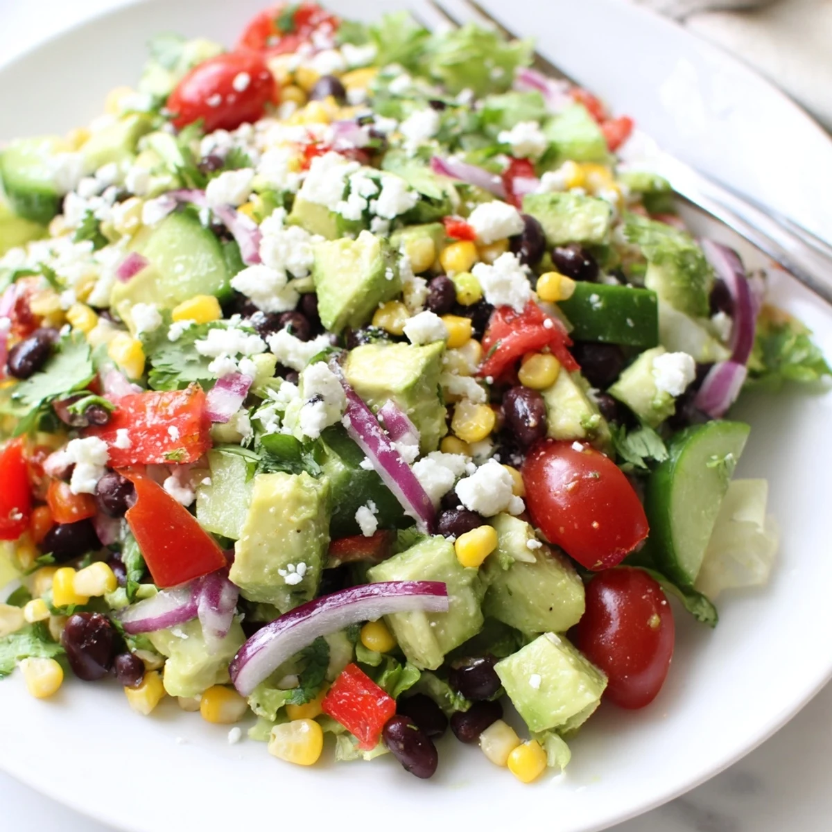 Vibrant Mexican chopped salad tossed in zesty lime cilantro dressing served fresh