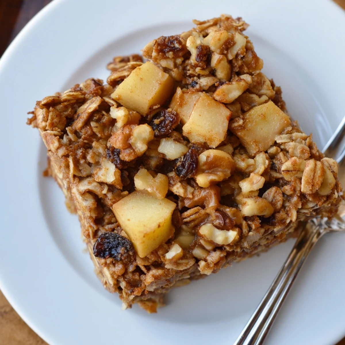 Delicious Apple Cinnamon Oatmeal Bake Recipe For Mornings warm, golden, spiced, served with yogurt