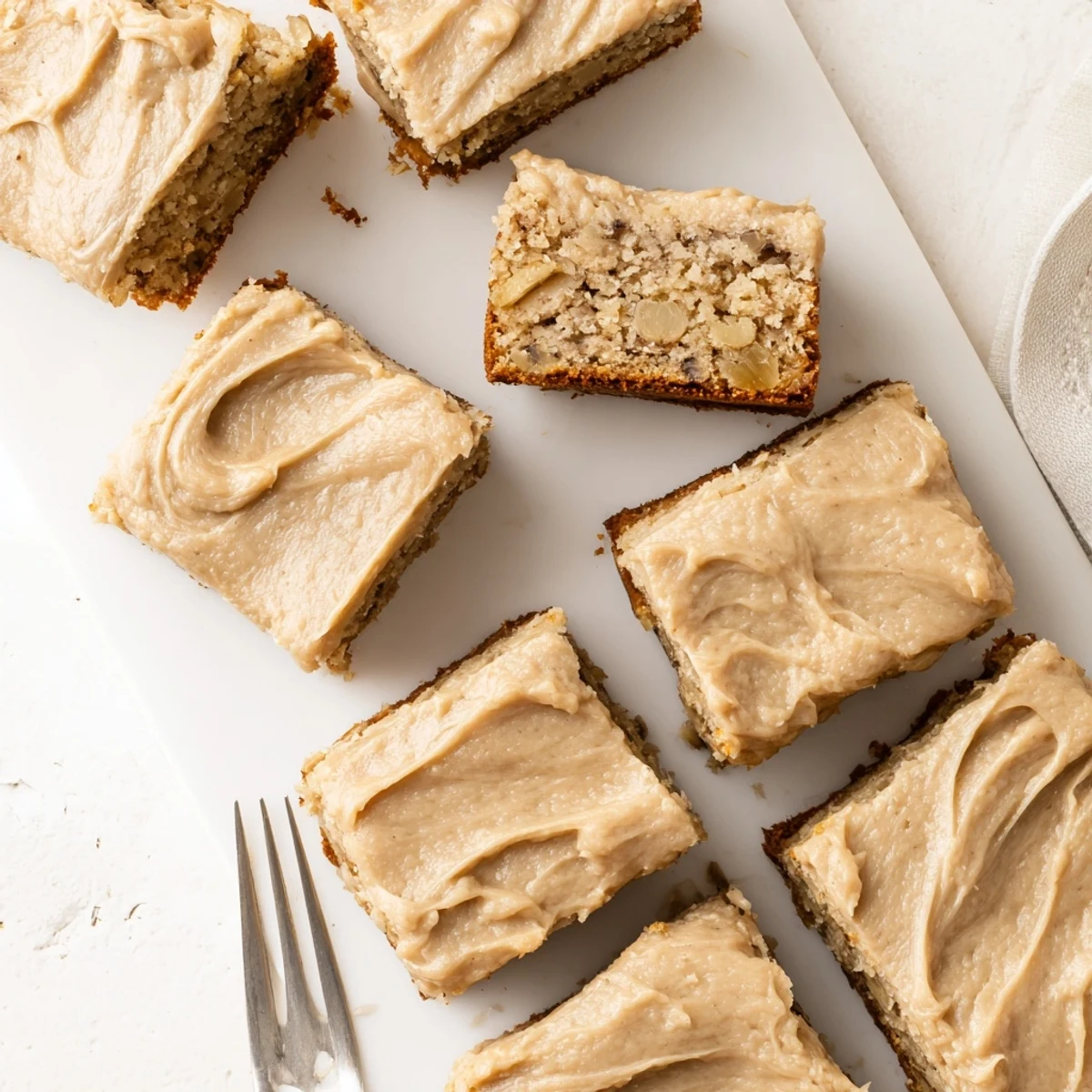 Moist banana bread brownies bars spread with thick nutty brown butter frosting