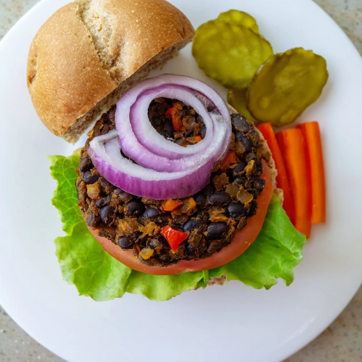 Flavorful vegetarian veggie burgers recipe topped with melted cheese and served with sweet potato fries