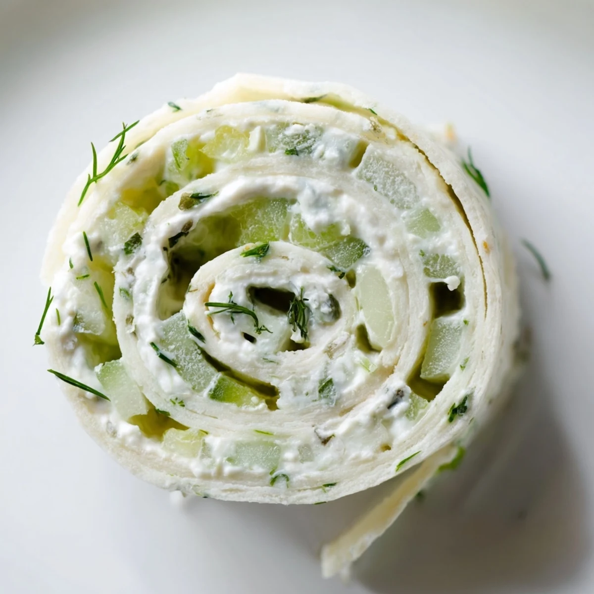 Chilled Cucumber And Dill Pinwheels sliced into spirals, crisp cucumber bites.