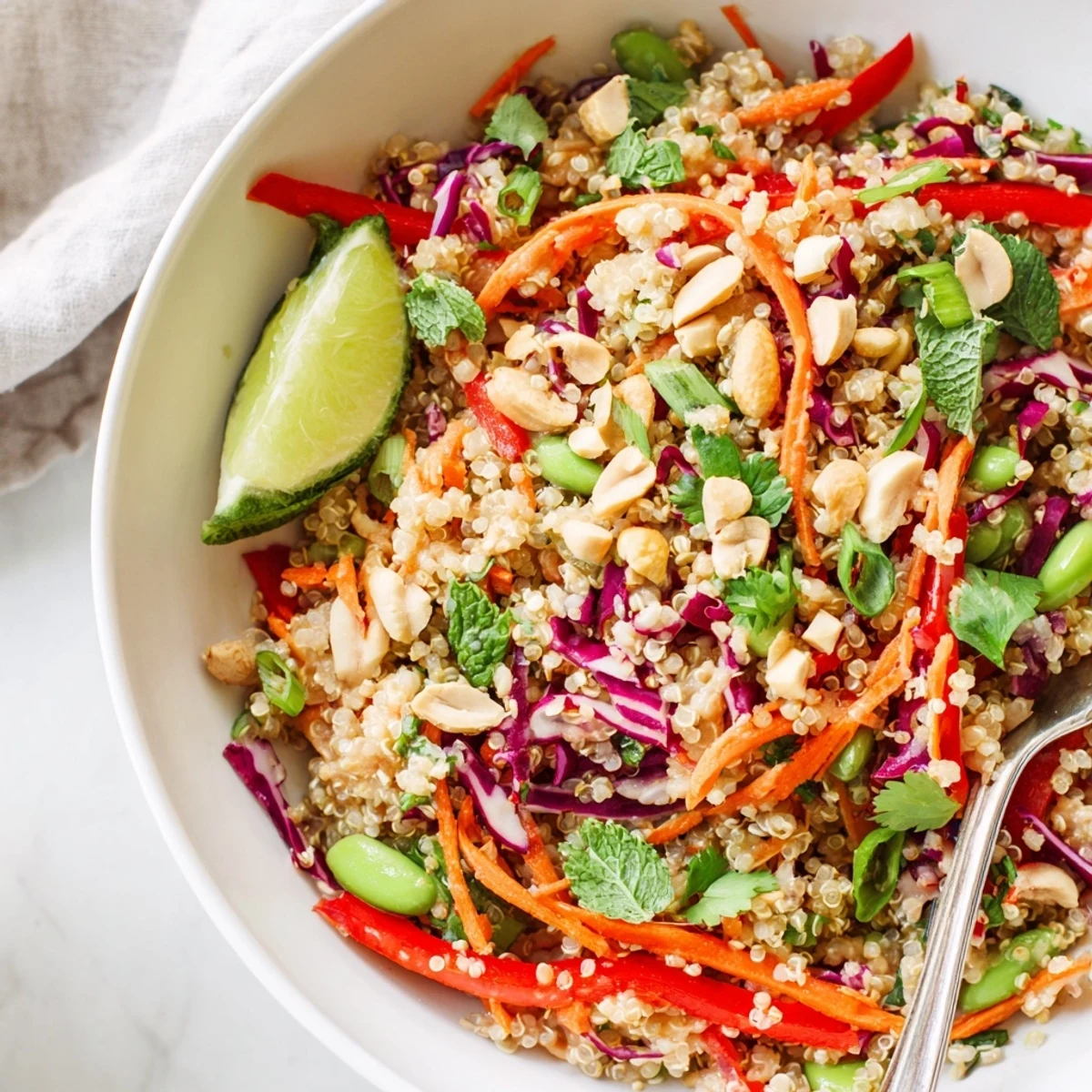 Thai Quinoa Crunch Salad with vibrant herbs, crunchy peanuts, and zesty dressing
